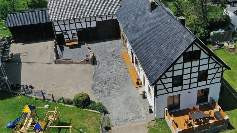 A beautiful farmhouse with a large garden and a playground. The terrace invites you to relax outdoors.