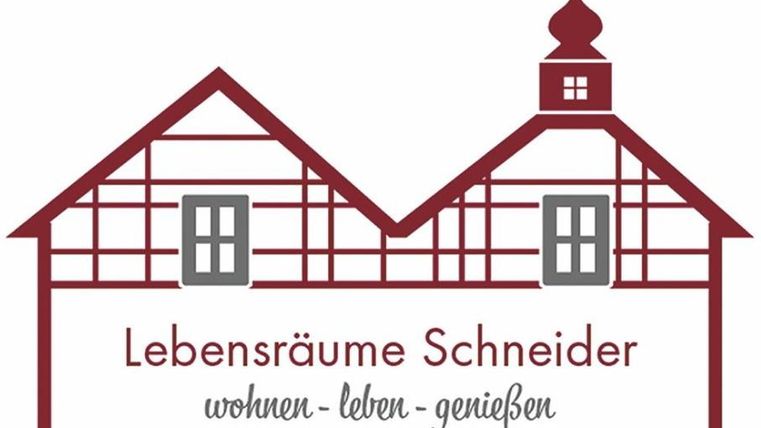 A logo with two stylized half-timbered houses. Below it, it says "Lebensräume Schneider" with the slogan "living - enjoying - savoring".